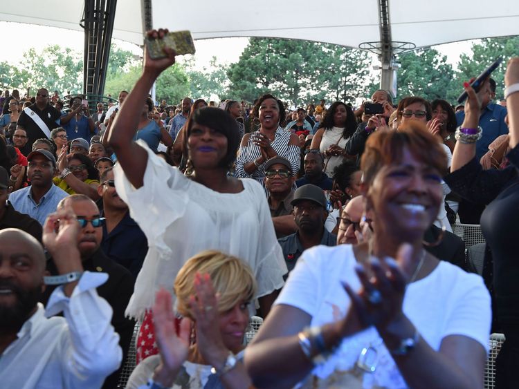 People cheer during the Aretha Franklin tribute event 