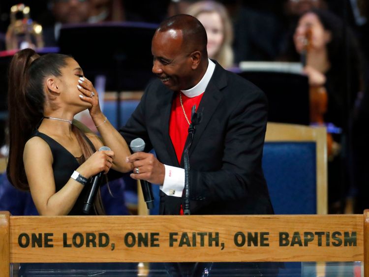 Ariana and Bishop Ellis share a laugh after her performance