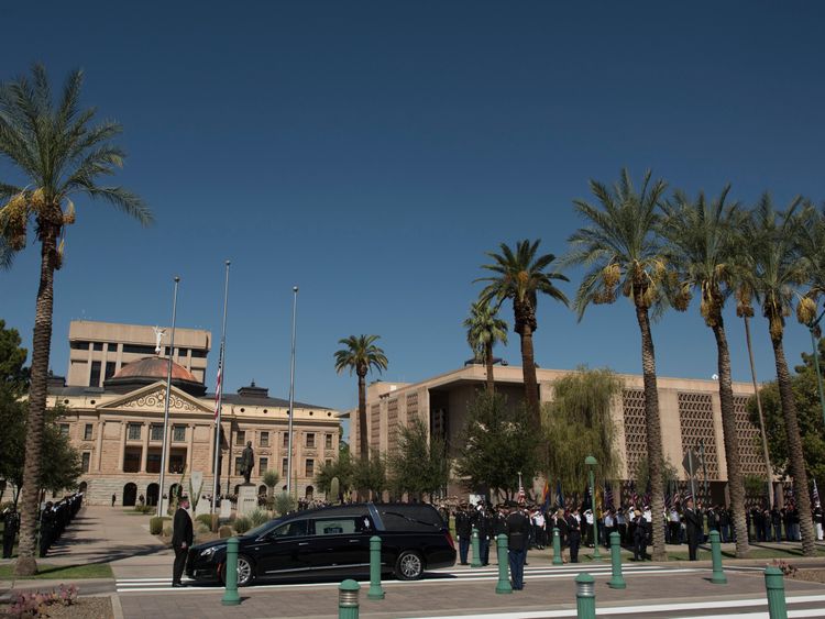 A motorcade accompanied Mr McCain's hearse to the Arizona State Capitol