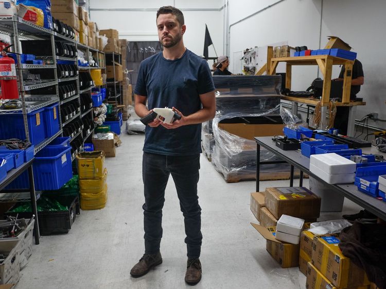 Cody Wilson, owner of Defense Distributed company, holds a 3D printed gun, called the 'Liberator', in his factory in Austin, Texas on August 1, 2018. - The US 'crypto-anarchist' who caused panic this week by publishing online blueprints for 3D-printed firearms said Wednesday that whatever the outcome of a legal battle, he has already succeeded in his political goal of spreading the designs far and wide