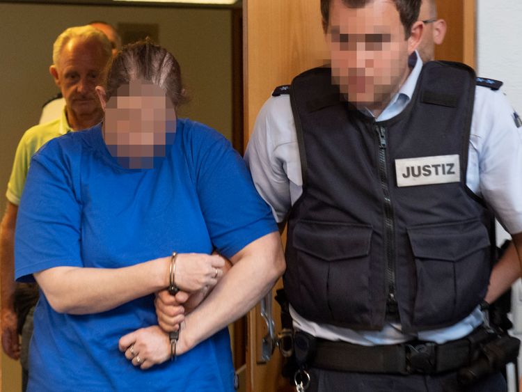 The defendant Berrin T (L) is led to the courtroom of the district court in Freiburg, southern Germany, on August 7, 2018. - Berrin T and Christian L, both German nationals, stand accused of rape, aggravated sexual assault of children, forced prostitution and distribution of child pornography. (Photo by THOMAS KIENZLE / AFP) (Photo credit should read THOMAS KIENZLE/AFP/Getty Images)