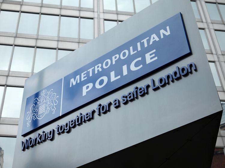ndon, England - May 8, 2011: The famous New Scotland Yard sign, outside the Metropolitan police headquarters in London.