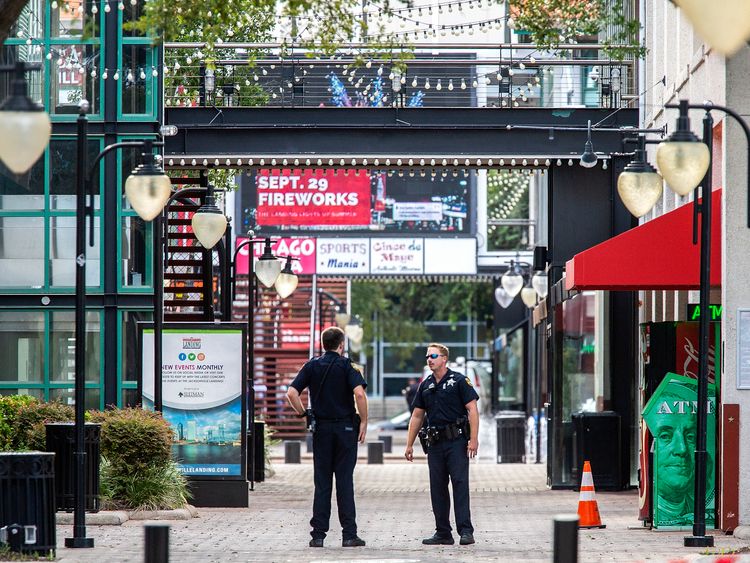JACKSONVILLE, FL - AUGUST 26: Jacksonville Sheriff's officers patrol around the ships at Jacksonville Landing on August 26, 2018 in Jacksonville, Florida. A shooting rampage during a Madden 19 video game tournament at the site claimed four lives, with several others wounded, according to published reports. (Photo by Mark Wallheiser/Getty Images)