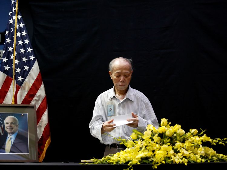Vietnamese veteran Pham Minh Chuc, 81, pays his respects