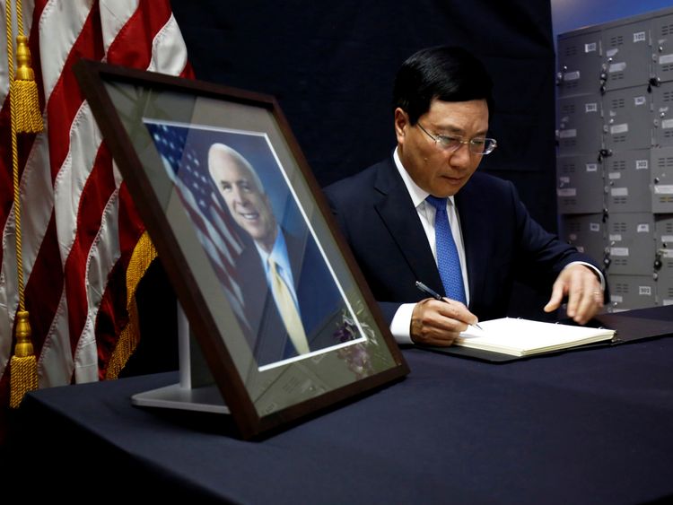Vietnam's Foreign Minister Pham Binh Minh writes in a condolence book