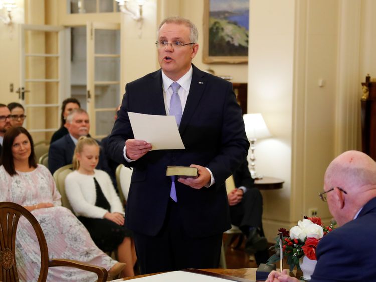 Scott Morrison attends a swearing-in ceremony to become new prime minister