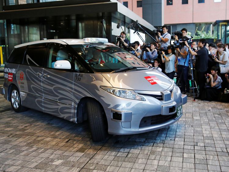 ZMP Inc's RoboCar MiniVan, a self-driving taxi based on a Toyota Estima Hybrid car, operated by Hinomaru Kotsu Co, is seen at the start of its services proving test in Tokyo, Japan August 27, 2018. REUTERS/Toru Hanai