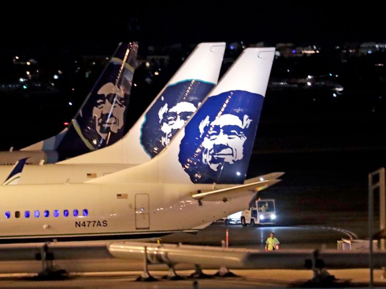 Alaska Airlines planes sit on the tarmac at Sea-Tac International Airport Friday evening, Aug. 10, 2018, in SeaTac, Wash. Officials at Sea-Tac International Airport say an Alaska Airlines plane that was stolen by an airline employee and has crashed in Washington state. Airport officials said in a tweet Friday night that an airline employee "conducted an unauthorized takeoff without passengers." (AP Photo/Elaine Thompson)