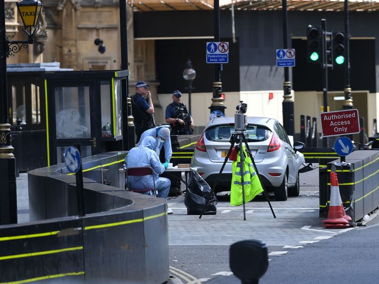Forensics officers are at work at the scene 