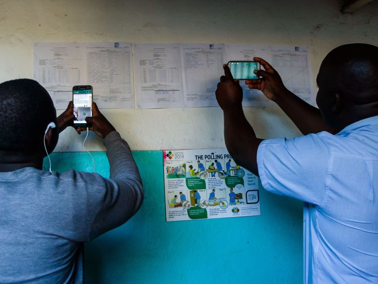 People take pictures of the results at a polling station in Kambuzuma Township, Harare

ballot count results outside a polling station in Kambuzuma Township, Harare