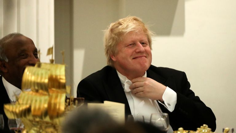 Boris Johnson reacts before speaking at a banquet with diplomats at Mansion House in London