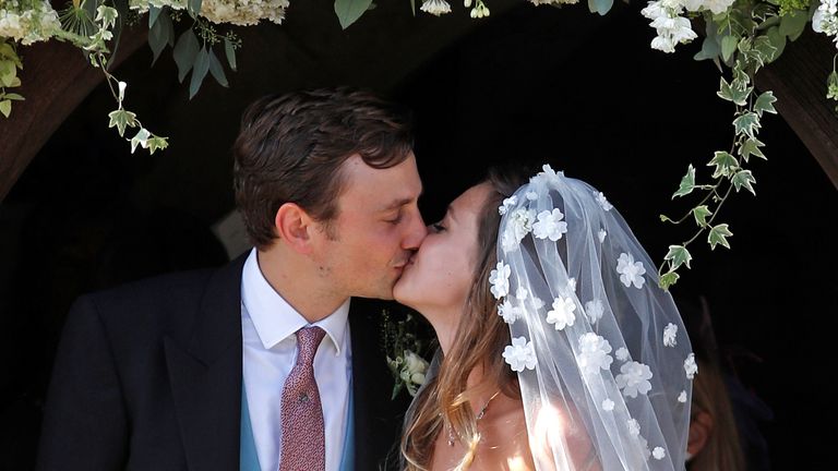 Daisy Jenks and Charlie Van Straubenzee emerge from the church after tying the knot