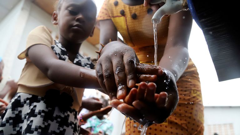 A Congolese child washes her hands as a preventive measure against Ebola at the Church of Christ in Mbandaka, Democratic Republic of Congo May 20, 2018