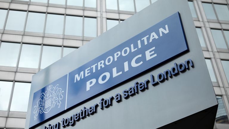 ndon, England - May 8, 2011: The famous New Scotland Yard sign, outside the Metropolitan police headquarters in London.