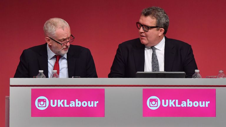 Labour Party leader Jeremy Corbyn (L) sits alongside deputy leader Tom Watson at the Labour Party conference in 2017