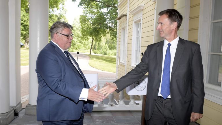 Finland&#39;s Foreign Minister Timo Soini and Britain&#39;s Foreign Secretary Jeremy Hunt shake hands as they attend a joint news conference in Vantaa, Finland August 14, 2018. LEHTIKUVA/Vesa Moilanen/via REUTERS ATTENTION EDITORS - THIS IMAGE WAS PROVIDED BY A THIRD PARTY. NO THIRD PARTY SALES. FINLAND OUT.