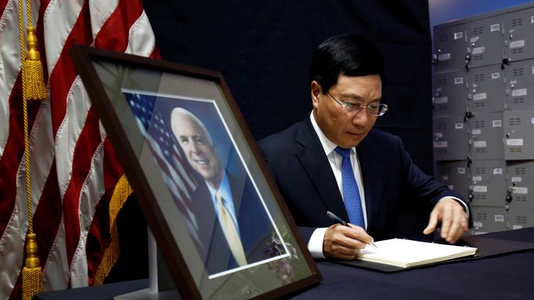 Vietnam&#39;s Foreign Minister Pham Binh Minh writes in a condolence book