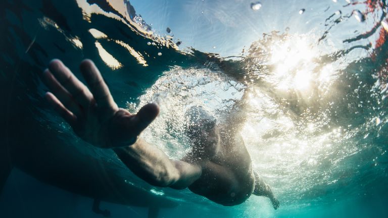 Renowned endurance swimmer and United Nation...s Environment Programme (UNEP)...s Patron of the Oceans, Lewis Pugh swims towards Start Point, United Kingdom during The Long Swim campaign on 25 July 2018