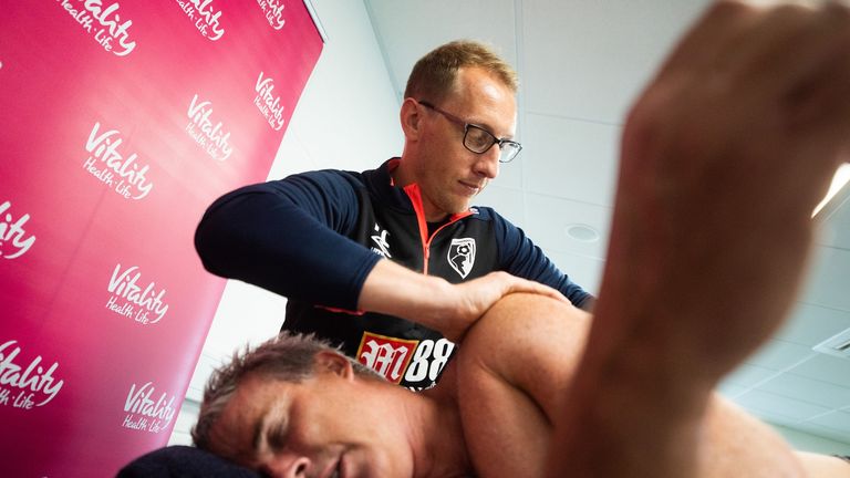 Lewis Pugh receives some help from physiotherapy staff at Bournemouth