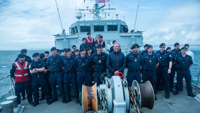 Lewis was invited to have a hot shower after he boarded the navy vessel