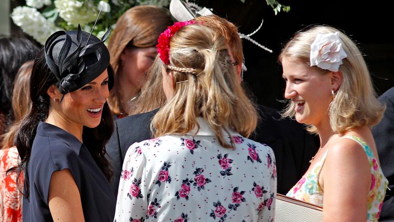 Meghan chats to guests at the wedding of Charlie van Straubenzee and Daisy Jenks