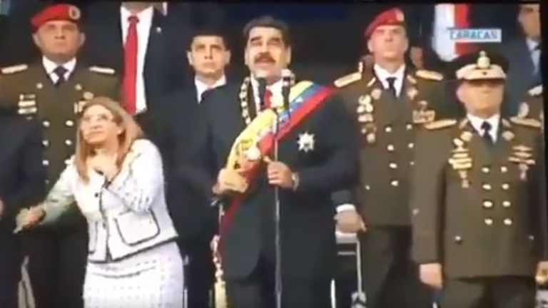 President Nicolas Maduro and his wife Cilia Flores were seen flinching and looking up at the explosions