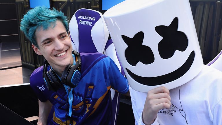 Ninja poses alongside fellow gamer Marshmello during the Epic Games Fortnite E3 Tournament