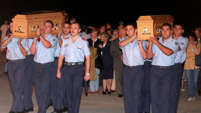 Spanish Air Force soldiers carry the coffins of two Spanish Omagh victims