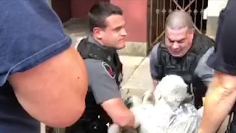 Police struggle to arrest man covered in white paint in Pennsylvania