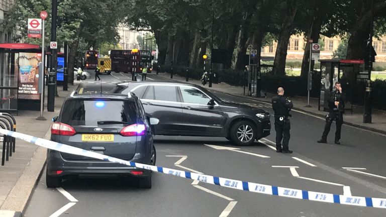 Police vehicles in Westminster after a vehicle crashes into the Houses of Parliament