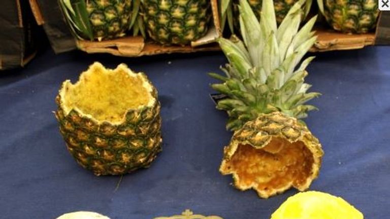 The 67kg haul was found inside dozens of hollowed-out pineapples. Pic: Policia Nacional