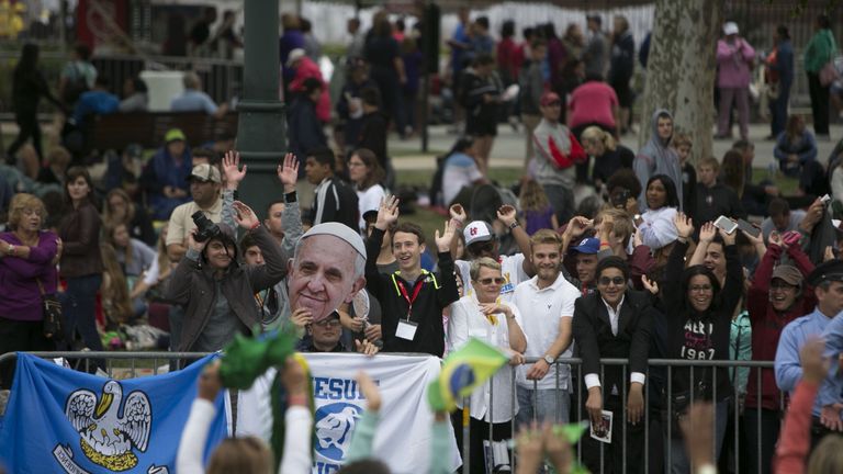 PHILADELPHIA, PA - SEPTEMBER 27: People wait for Pope Francis pass on his way to celebrate mass along Benjamin Franklin Parkway on September 27, 2015 in Philadelphia, Pennsylvania. Pope Francis wrapped up his United States tour with the World Meeting of Families Papal Mass during on the Benjamin Franklin Parkway. (Photo by Jessica Kourkounis/Getty Images)

