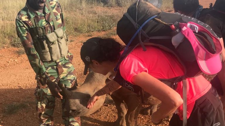 Runner Liz Winton with a rhino that will be protected by rangers