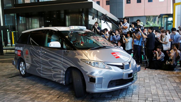 ZMP Inc&#39;s RoboCar MiniVan, a self-driving taxi based on a Toyota Estima Hybrid car, operated by Hinomaru Kotsu Co, is seen at the start of its services proving test in Tokyo, Japan August 27, 2018. REUTERS/Toru Hanai