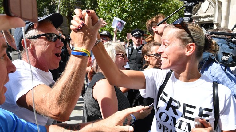 Supporters of Tommy Robinson celebrate outside the Royal Courts of Justice in London, where the former English Defence League (EDL) leader has been freed on bail by the Court of Appeal after winning a challenge against a finding of contempt of court.
