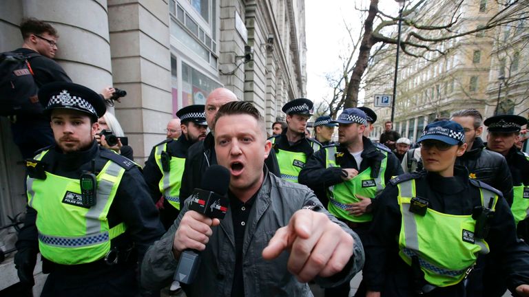 Stephen Christopher Yaxley-Lennon, AKA Tommy Robinson, former leader of the right-wing EDL (English Defence League) is escorted away by police from a Britain First march and an English Defence League march in central London on April 4, 2017
