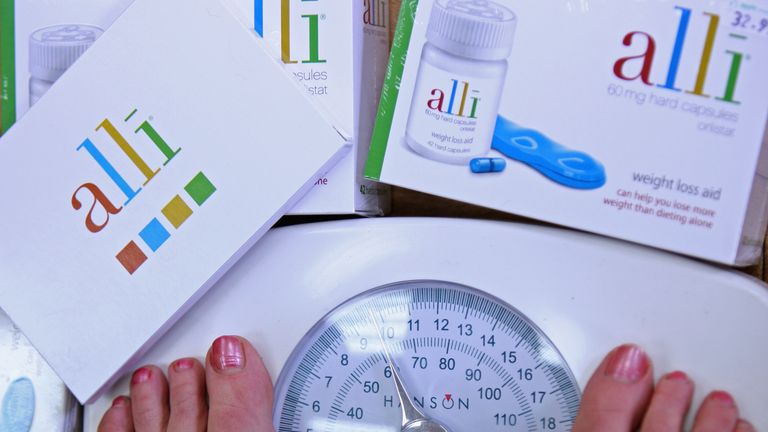 In this photo illustration a G W Allan chemists stocks the Alli slimming pill on April 23, 2009 in Edinburgh, Scotland. The slimming pill now available over the counter claims to cause 50 percent more weight loss when taken with every meal.