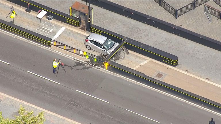 The damage to the front of the car is clearly seen from the air