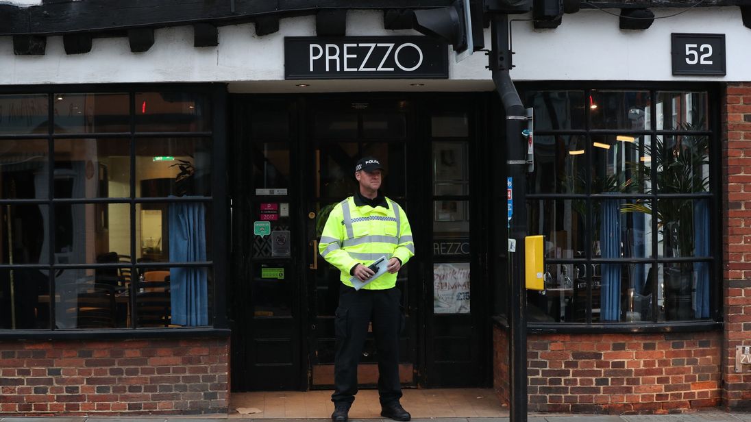 A police officer outside the Prezzo restaurant in Salisbury where a couple had become unwell after exposure to an unknown substance