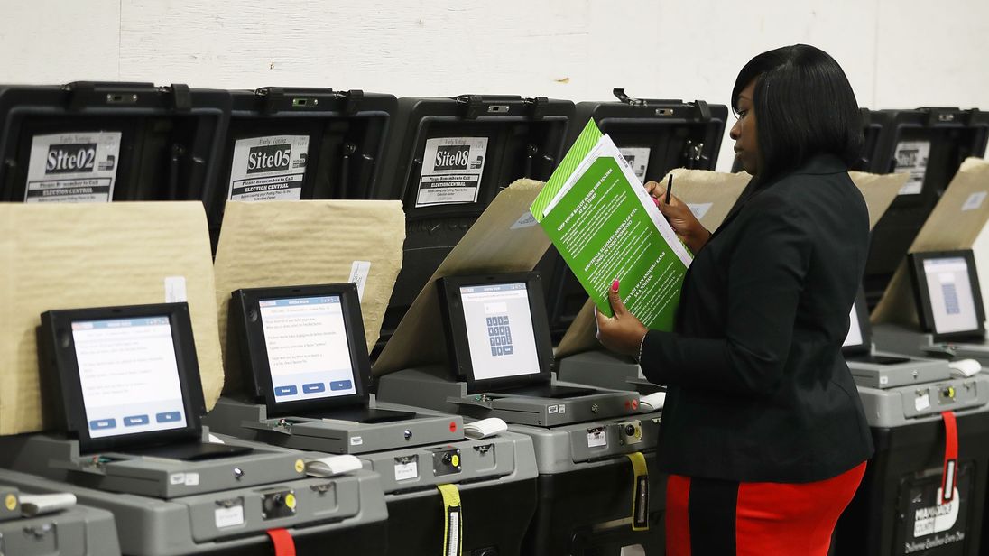 DORAL, FL - AUGUST 08: Andcherla Marcelin, a Miami-Dade election support specialists, checks voting machines for accuracy at the Miami-Dade Election Department headquarters on August 8, 2018 in Doral, Florida. The accuracy test includes setting up the equipment for transmitting and tabulating results. It is just one of several measures that are taken by Miami-Dade election department during the preparation for an election to ensure that voting equipment is ready for use. (Photo by Joe Raedle/Get