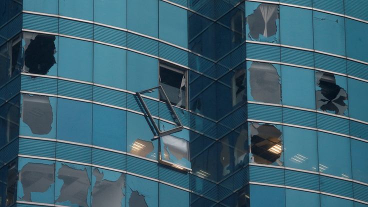 An office tower&#39;s windows are damaged following Typhoon Mangkhut in Hong Kong