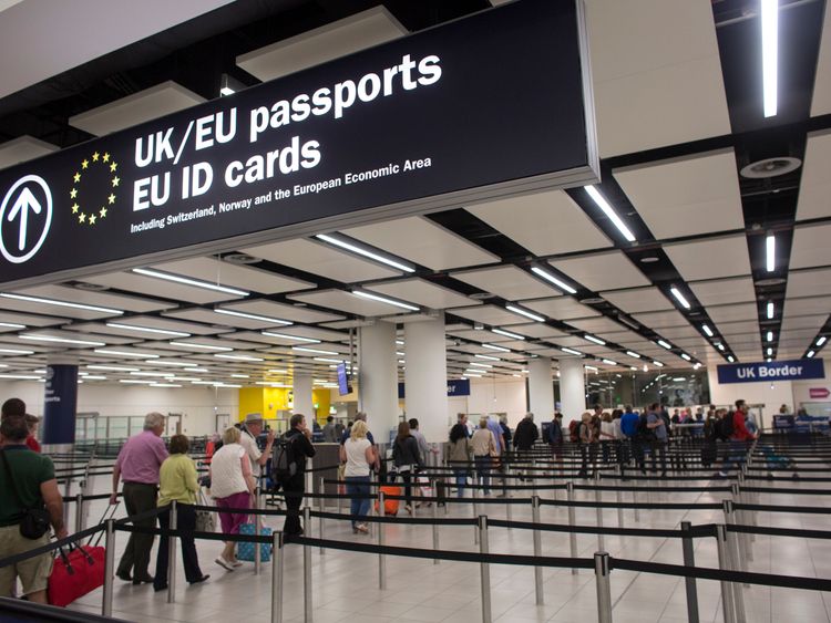 LONDON, ENGLAND - MAY 28: Border Force check the passports of passengers arriving at Gatwick Airport on May 28, 2014 in London, England. Border Force is the law enforcement command within the Home Office responsible for the security of the UK border by enforcing immigration and customs controls on people and goods entering the UK. Border Force officers work at 140 sea and airports across the UK and overseas. (Photo by Oli Scarff/Getty Images) 