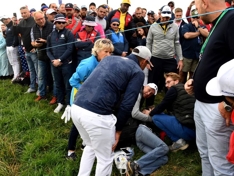US golfer Brooks Koepka with an injured spectator