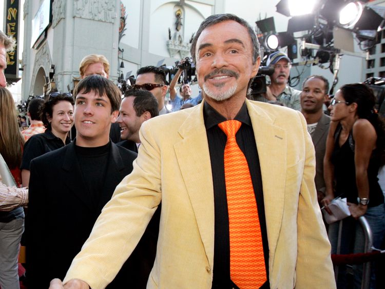 Actor Burt Reynolds (C), followed by his son Quinton (L), arrives at the Los Angeles premiere of the Warner Brothers pictures The Dukes Of Hazzard at the Grauman&#39;s Chinese theatre in Hollywood July 28, 2005