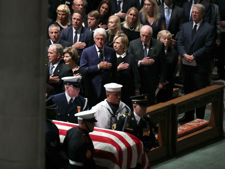 WASHINGTON, DC - SEPTEMBER 1: (L-R) Former U.S. President George W. Bush, Laura Bush, Former U.S. President Bill Clinton, former Secretary of State Hillary Clinton, former U.S. Vice President Dick Cheney, Lynne Cheney, and former U.S. Vice President Al Gore stand as the casket is brought in for the funeral service for U.S. Sen. John McCain at the National Cathedral on September 1, 2018 in Washington, DC. The late senator died August 25 at the age of 81 after a long battle with brain cancer. McCa