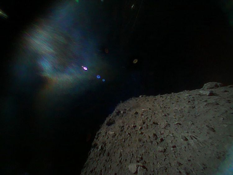 Taken immediately after separation from the spacecraft, this shows Hayabusa2 is at the top and the surface of Ryugu is bottom.