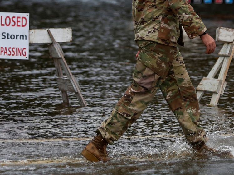 A member of the U.S. Army walks through floodwaters near the Union Point Park Complex as Hurricane Florence comes ashore in New Bern, North Carolina