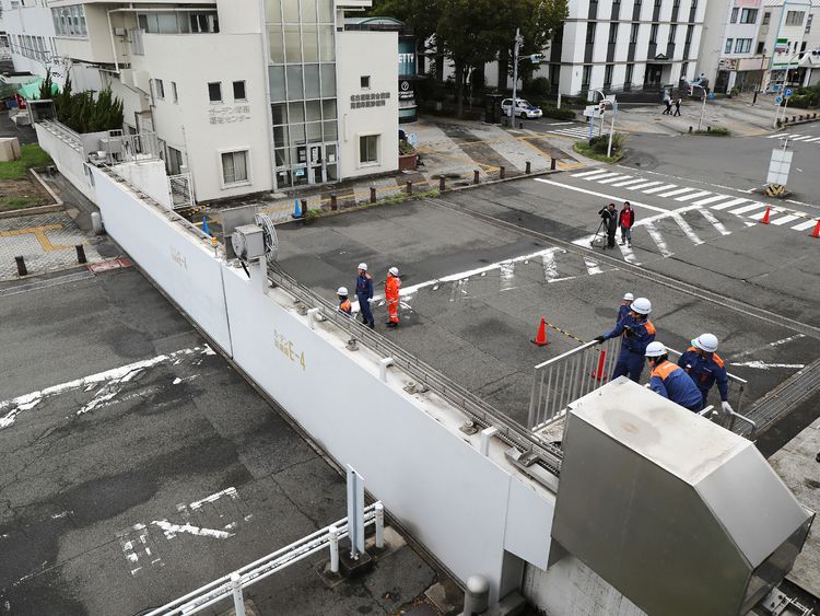 Nagoya port officers close the breakwater gates in Nagoya as Typhoon Jebi hit western Japan