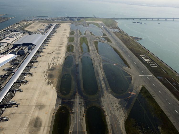 An aerial view shows a flooded runway at Kansai airport, which is built on a man-made island in a bay, after Typhoon Jebi hit the area