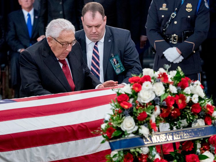 WASHINGTON, DC - AUGUST 31: Former Secretary of State Henry Kissinger touches the casket of Sen. John McCain, R-Ariz., as he lies in state in the Rotunda of the U.S. Capitol, on August 31, 2018 in Washington, DC. The late senator died August 25 at the age of 81 after a long battle with brain cancer. He will lie in state at the U.S. Capitol, a rare honor bestowed on only 31 people in the past 166 years. Sen. McCain will be buried at his final resting place at the U.S. Naval Academy. (Photo by And